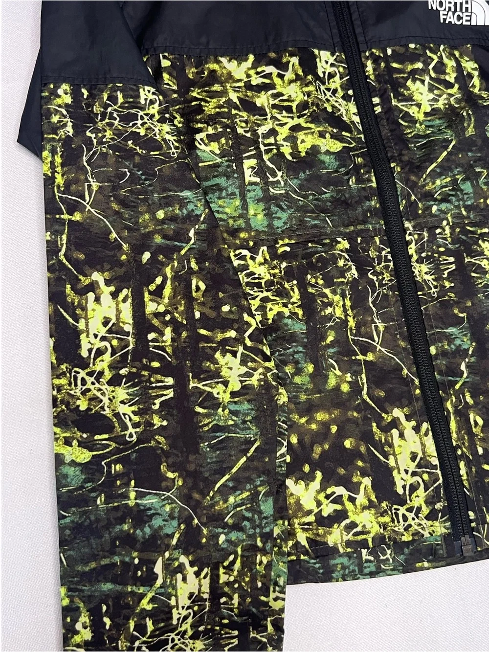 The North Face Kids Black Hooded Rain Jacket with Neon Green Print